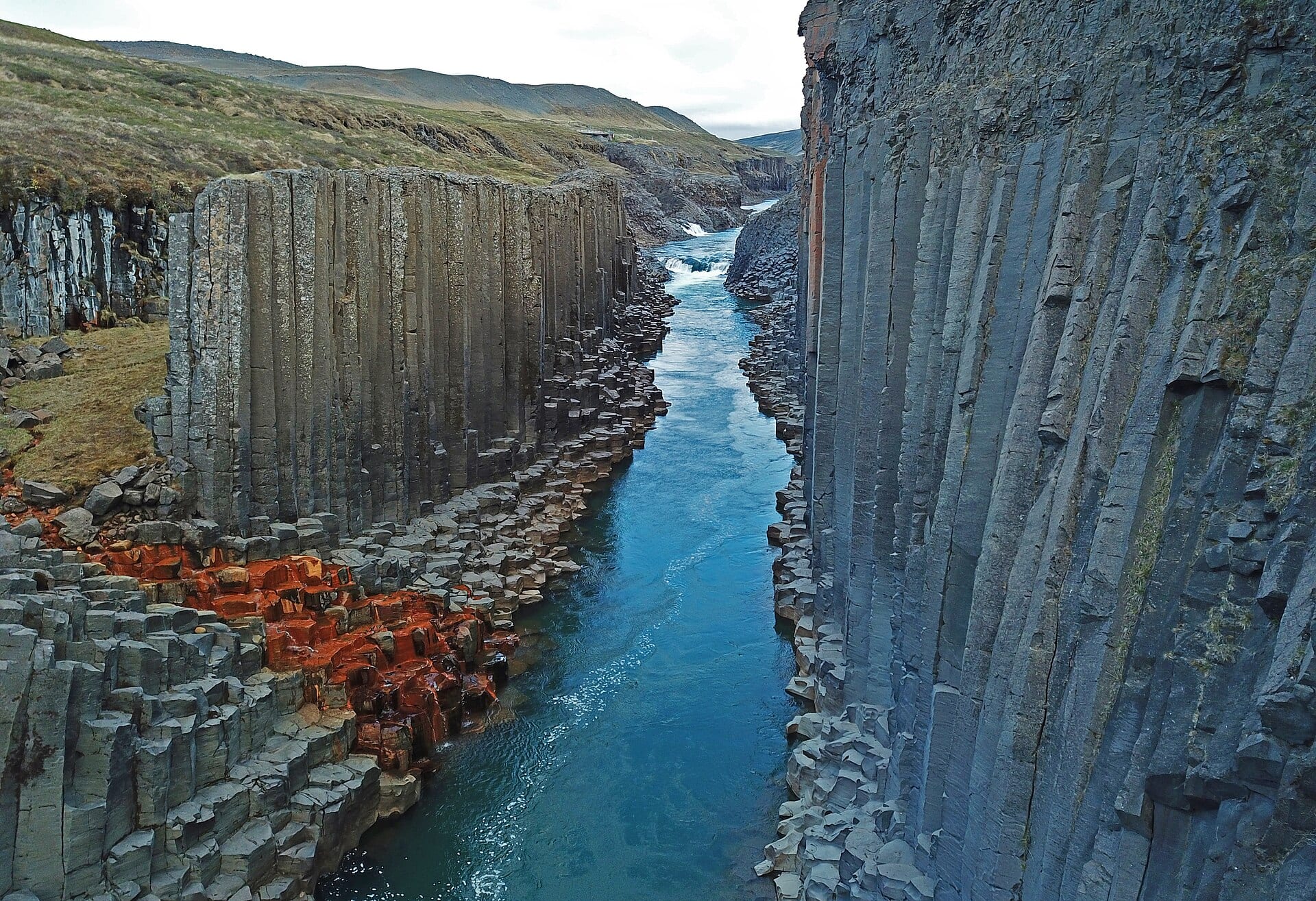 Drone view of hexagonal basalt columns in Stuðlagil canyon in Iceland.